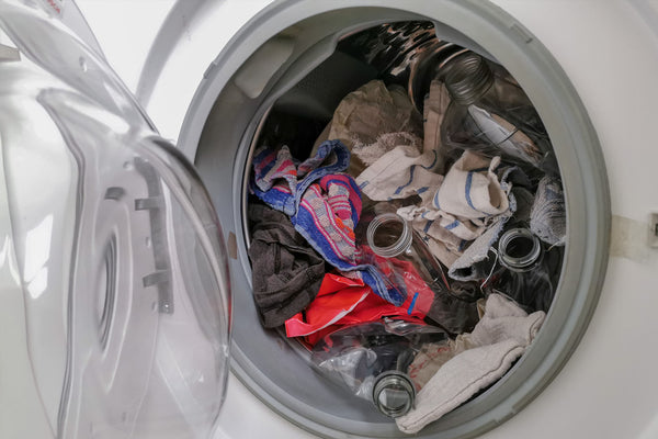 Washing machine filled with plastic waste representing micro plastic waste pollution during laundry