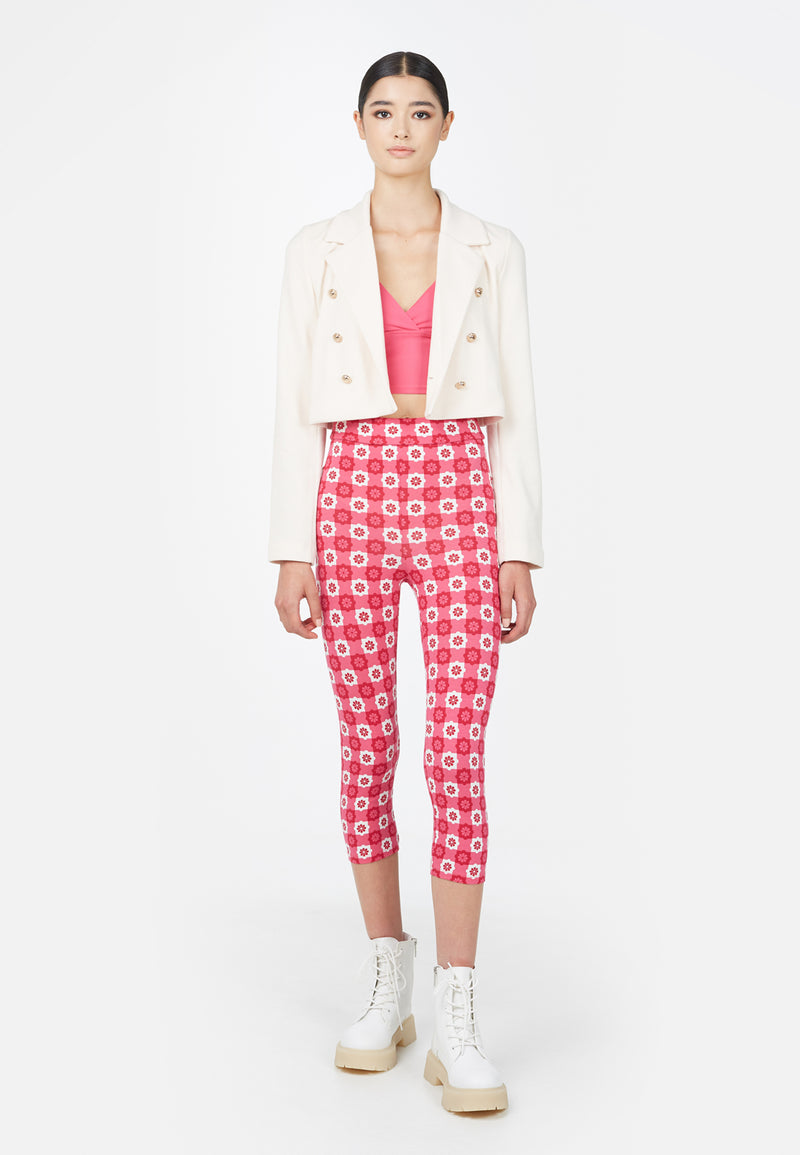 Model wears the Cropped Tailored Ladies Blazer in sheer pink by Gen Woo with pink patterned leggings