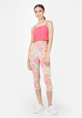 The model poses in the Retro Floral Cropped Ladies Leggings by Gen Woo