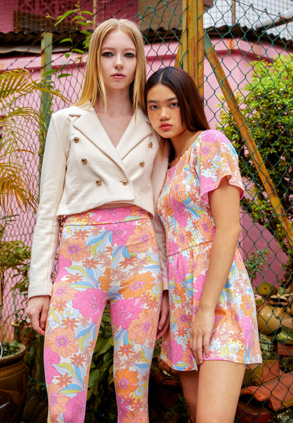 The model on the left wears the Retro Floral Cropped Ladies Leggings by Gen Woo