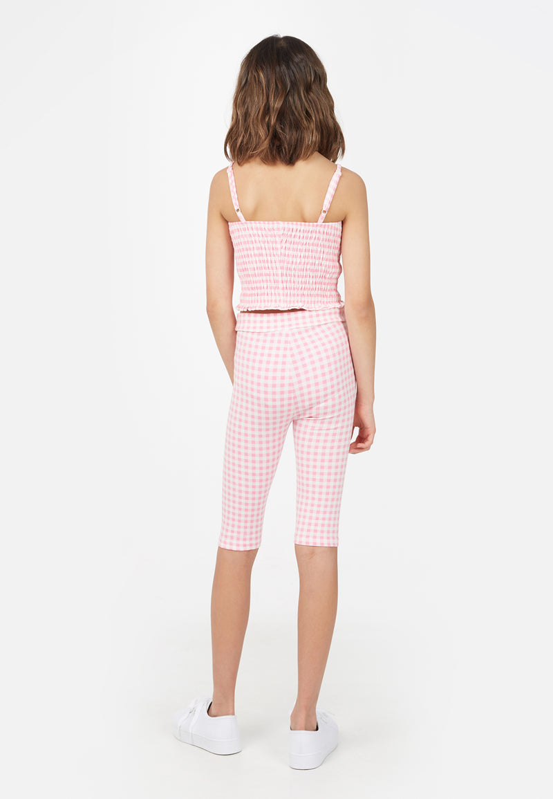Back view of the teenage girl in the Gingham Shirred Strappy Girls Crop Top by Gen Woo