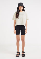 The model wears the Ladies Boxy Cropped Slogan T-Shirt by Gen Woo