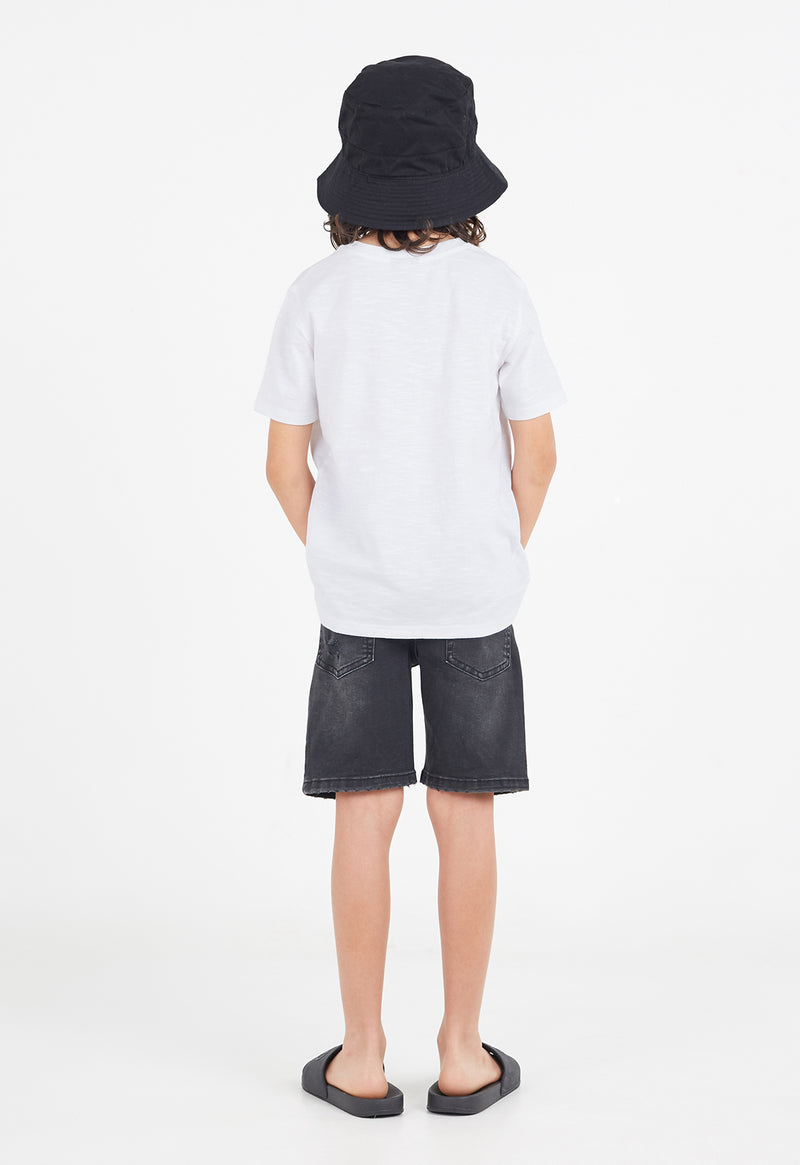 Back view as the young boy wears the Boys Classic Crew Neck White T-Shirt by Gen Woo