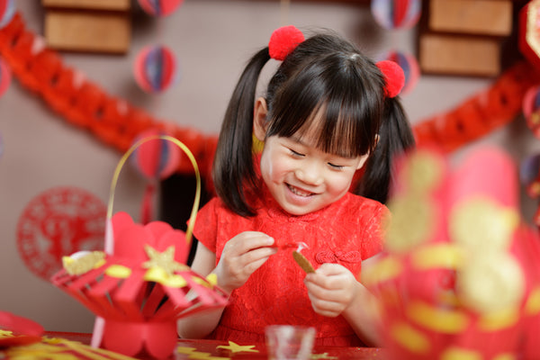 Girl making Chinese New Year Crafts