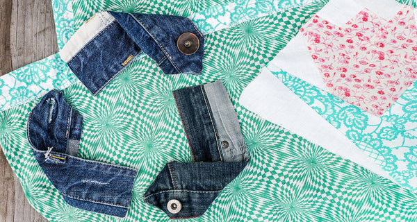 Circularity in fashion. Deadstock material with denim fabric in the shape of the reuse, recycle logo. (Enelx)