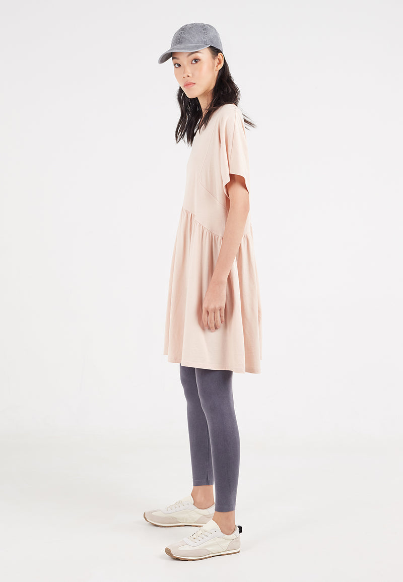 Ladies tunic by Gen Woo. Our oversized tunic tee has gathered detail at the mid panel and loose drapey shape. The rose coloured tunic could also be styled with leggings. -Side view
