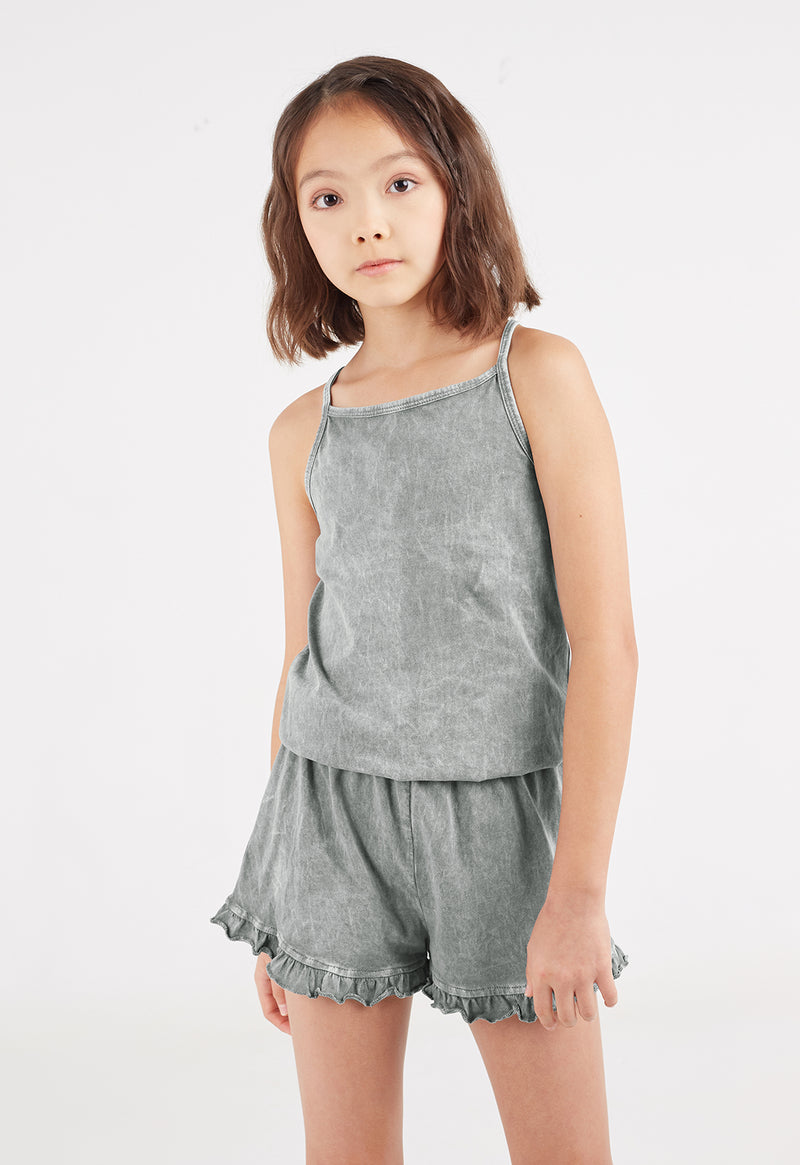 Close-up of the young girl wearing the Wash Effect Girls Summer Jumpsuit by Gen Woo