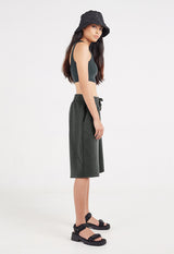Side view as the model wears the Ladies Elasticated Bermuda Lounge Shorts by Gen Woo