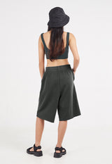 Back view as the model wears the Ladies Elasticated Bermuda Lounge Shorts by Gen Woo