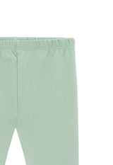Close-up of the Cotton Rich Green Baby Leggings by Gen Woo