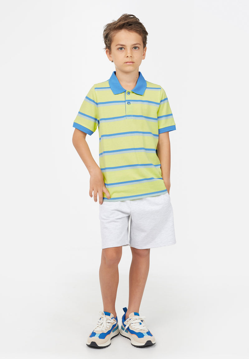 Model wears colour-contrast Lime Striped Boys Polo T-Shirt by Gen Woo. 