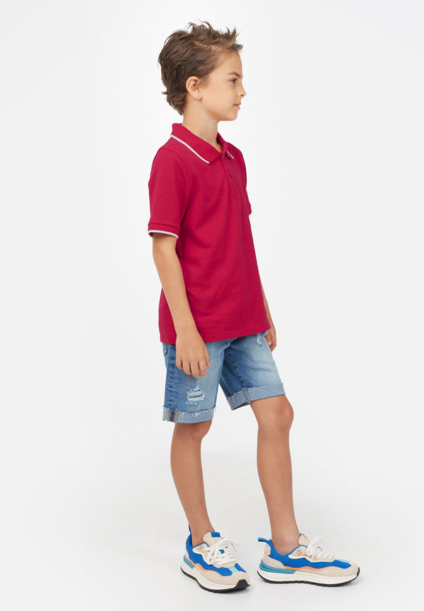 Side view of model wearing Berry Red Contrast Boys Polo T-Shirt by Gen Woo. 
