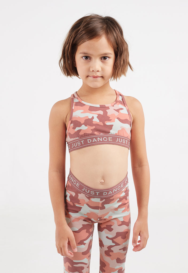 Close-up of the young girl wearing the Pink Camo Girls Racer Crop Top by Gen Woo