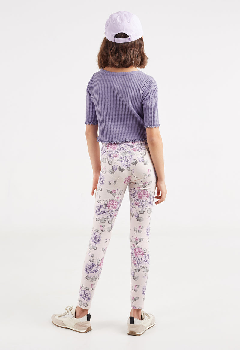 Back view of the young girl wearing the Everyday Girls Floral Print Leggings by Gen Woo