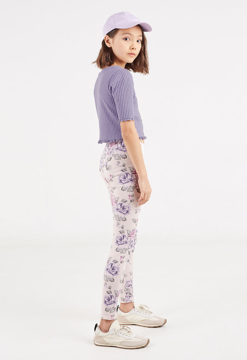 Side profile of the young girl wearing the Everyday Girls Floral Print Leggings by Gen Woo