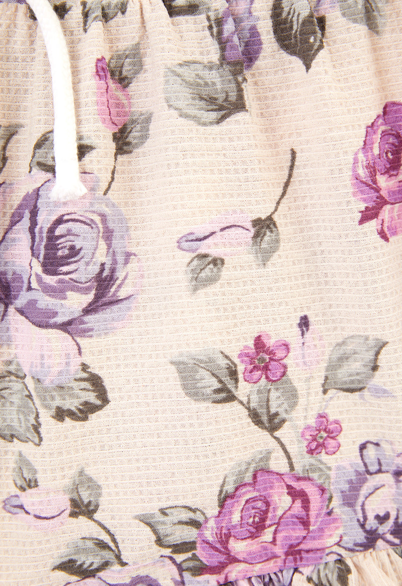 Close-up of the Pink and Purple Floral Bloom Peplum Girls Shorts by Gen Woo