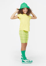 Model wears Lime Plaid Girls Cycling Shorts by Gen Woo. 