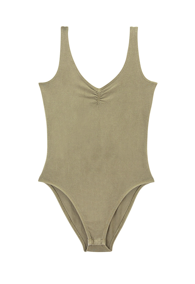 Ladies bodysuit by Gen Woo. Our fitted V-neckline bodysuit comes with popper fastening at the crotch. The coriander coloured bodysuit has a pretty gather detail at the chest and washed out effect. Please note that each washed out garment will have colour shade variation. -Front view