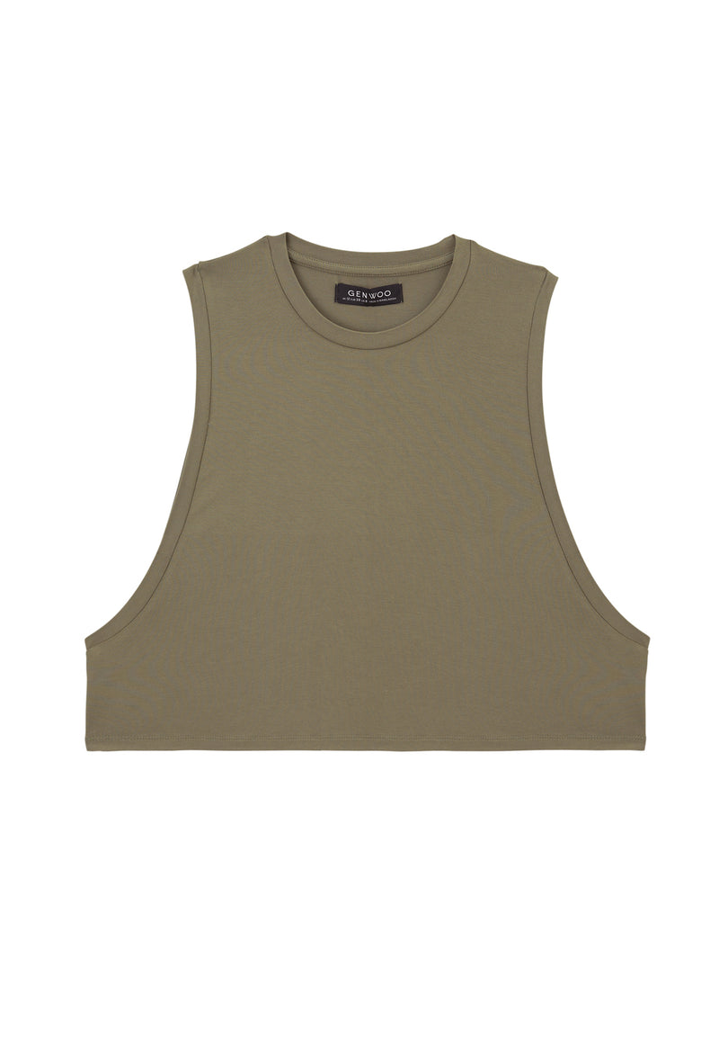 Ladies Vest by Gen Woo. Our coriander coloured vest is cropped length to mid waist. The vest has drapey and loose fit. Styled as a layering top for a sporty look. –Front view