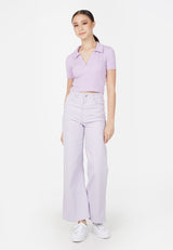 Model wears 90s Ladies Purple Cropped Polo T-Shirt by Gen Woo.