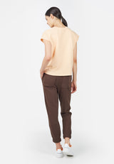 Back view of model wearing Basic Peach Boxy Ladies T-Shirt by Gen Woo. 