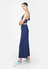 Side profile of the model in the Twill Cropped Wide Leg Ladies Trousers by Gen Woo