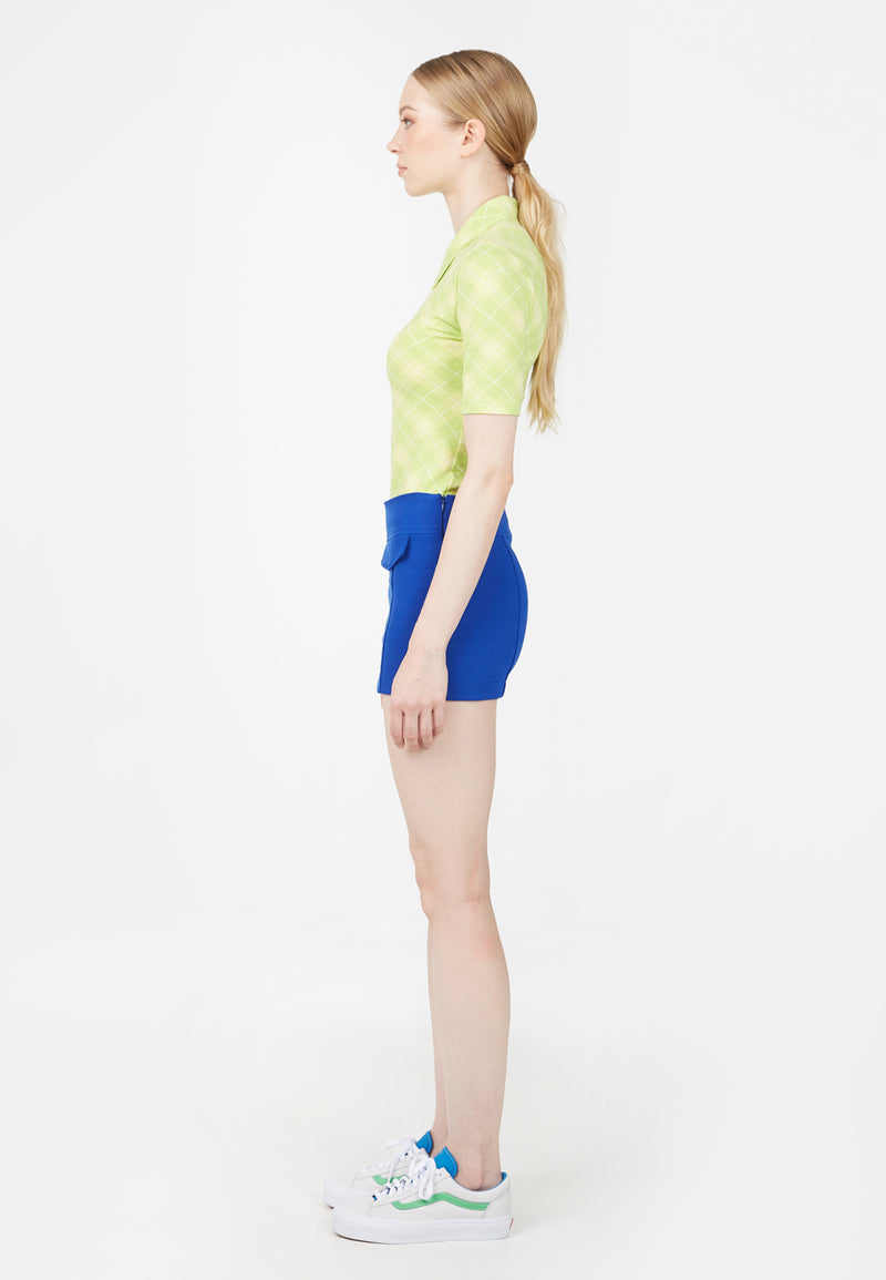 Side view of model wearing Ladies Lime Retro Plaid Polo T-Shirt by Gen Woo.