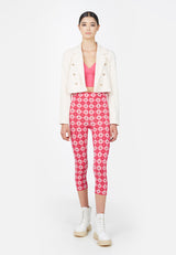 Model wears the Cropped Tailored Ladies Blazer in sheer pink by Gen Woo with pink patterned leggings