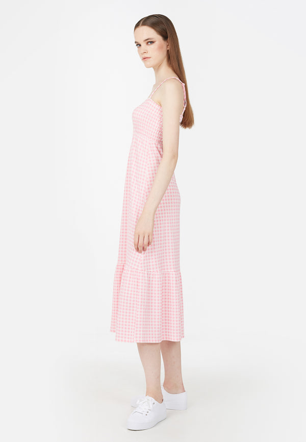 Side profile of the model in the Pink Gingham Ladies Maxi Dress by Gen Woo