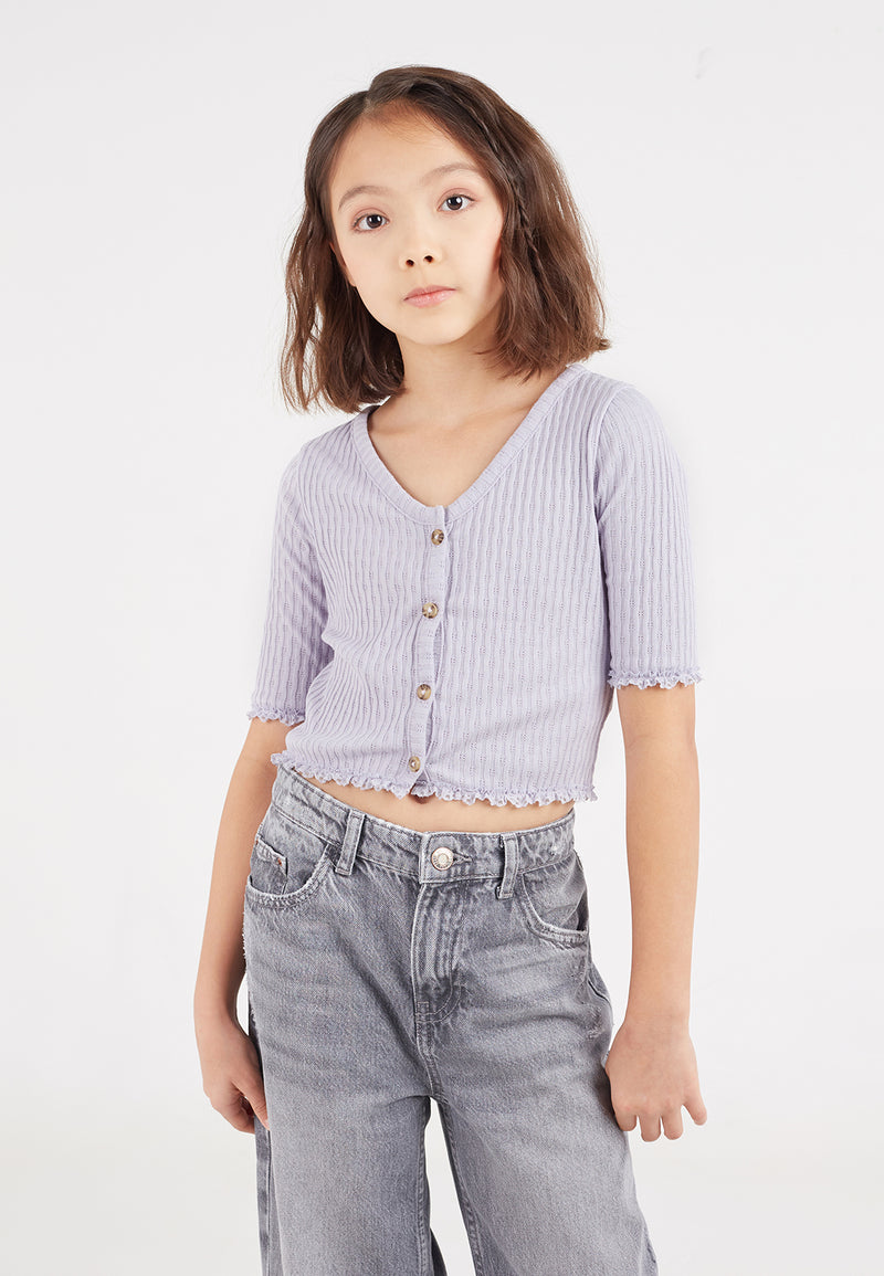 Close-up of the teen girl wearing the Lilac Pointelle Henley Girls Cropped Top by Gen Woo