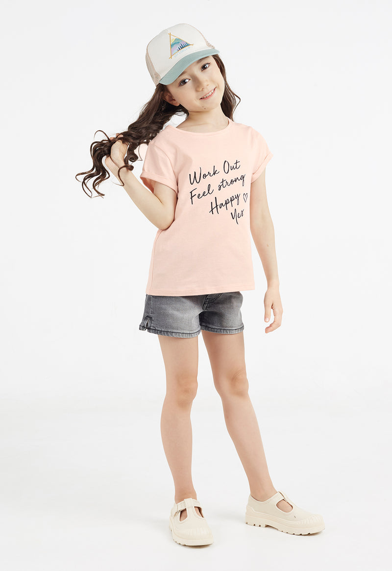 The young girl flicks her hair wearing the “Work Out, Feel Strong, Happy, Yes” Girls Slogan T-Shirt by Gen Woo