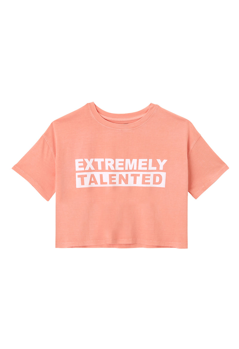 Front of the Pink “Extremely Talented” Slogan Girls Boxy Cropped T-Shirt by Gen Woo
