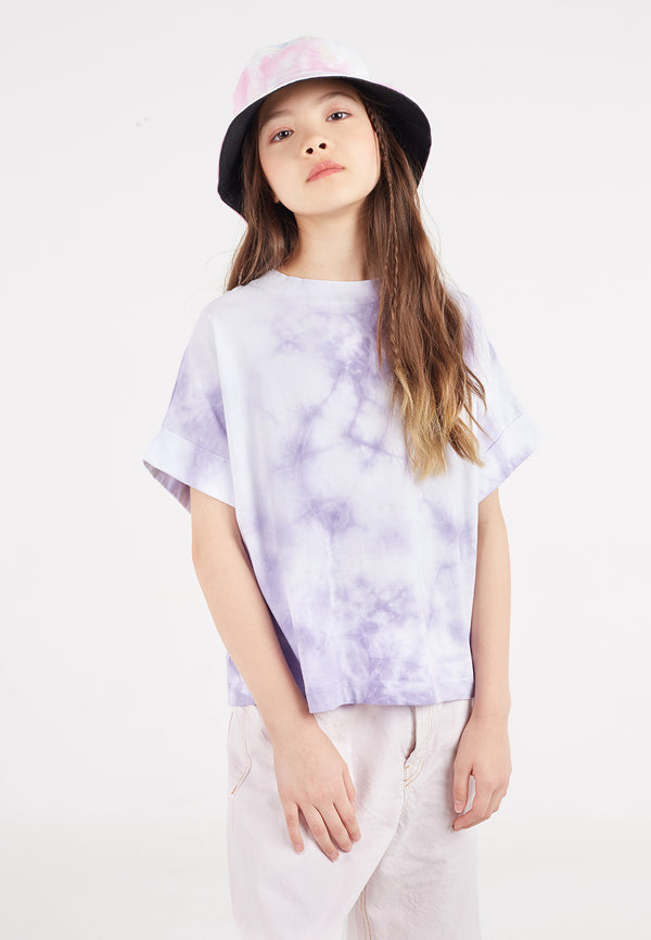 A close-up of the teen girl wearing the Purple and White Girls Tie-Dye T-Shirt by Gen Woo