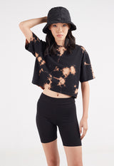 Model wears bucket hat and Ladies Black Acid Wash Boxy T-Shirt by Gen Woo.