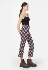 Side view as the teen girl wears the Plaid Flare Crop Trousers by Gen Woo