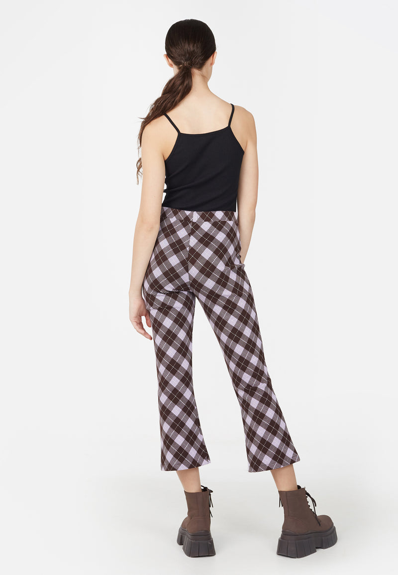 Back view as the teen girl wears the Plaid Flare Crop Trousers by Gen Woo