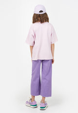 Back view of model wearing Teen Lavender Varsity T-Shirt by Gen Woo. 