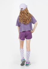 Back view of model wearing Teen Violet Varsity Crop T-Shirt by Gen Woo. 