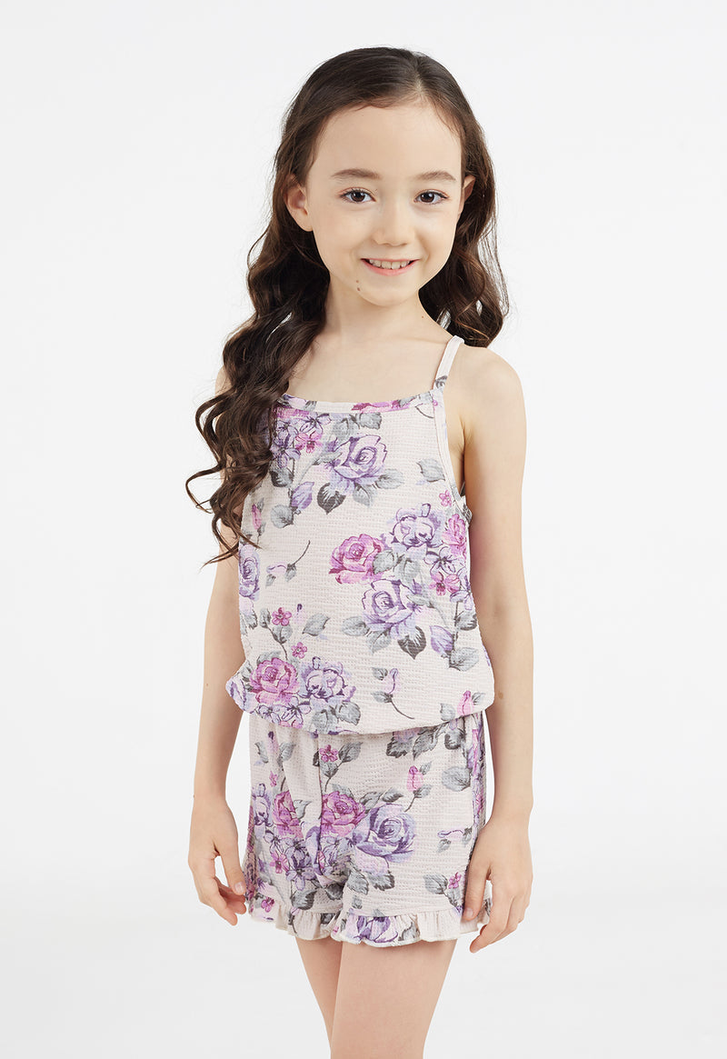  The young girl wears the Floral Bloom Girls Jumpsuit by Gen Woo