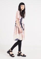 The model wears the Ladies Oversized Tie Dye Tunic Top by Gen Woo with leggings and chunky sandals