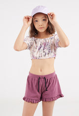 Close-up of the teen girl modelling the Damson Cotton Peplum Frill Girls Shorts by Gen Woo