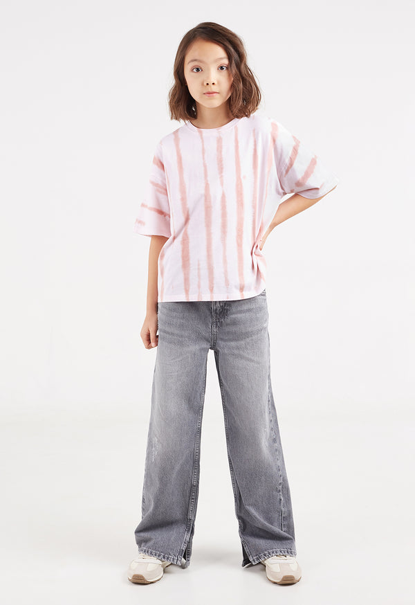 The teen girl models the Pink Striped Tie-Dye Girls T-Shirt by Gen Woo