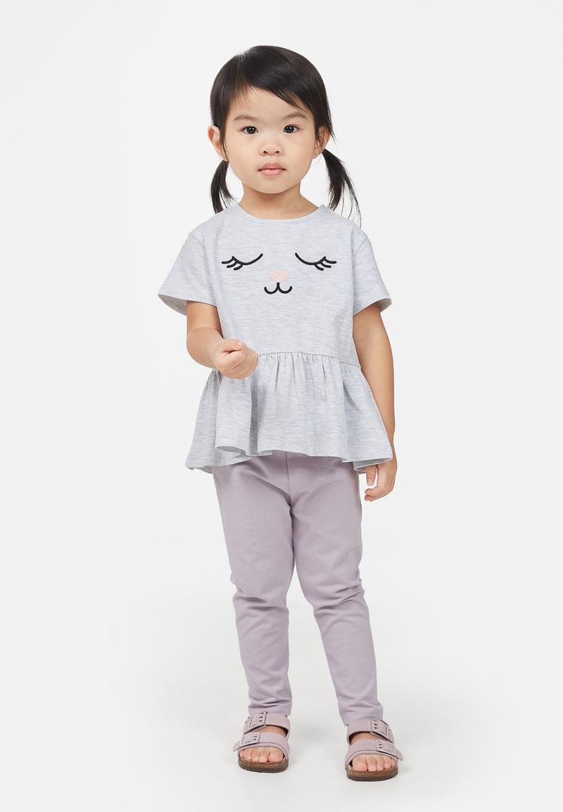 The young girl wears the Cotton Rich Lilac Baby Leggings by Gen Woo