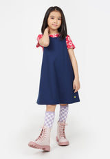 Young girl wears the Navy Blue Twill Pinafore Dress by Gen Woo