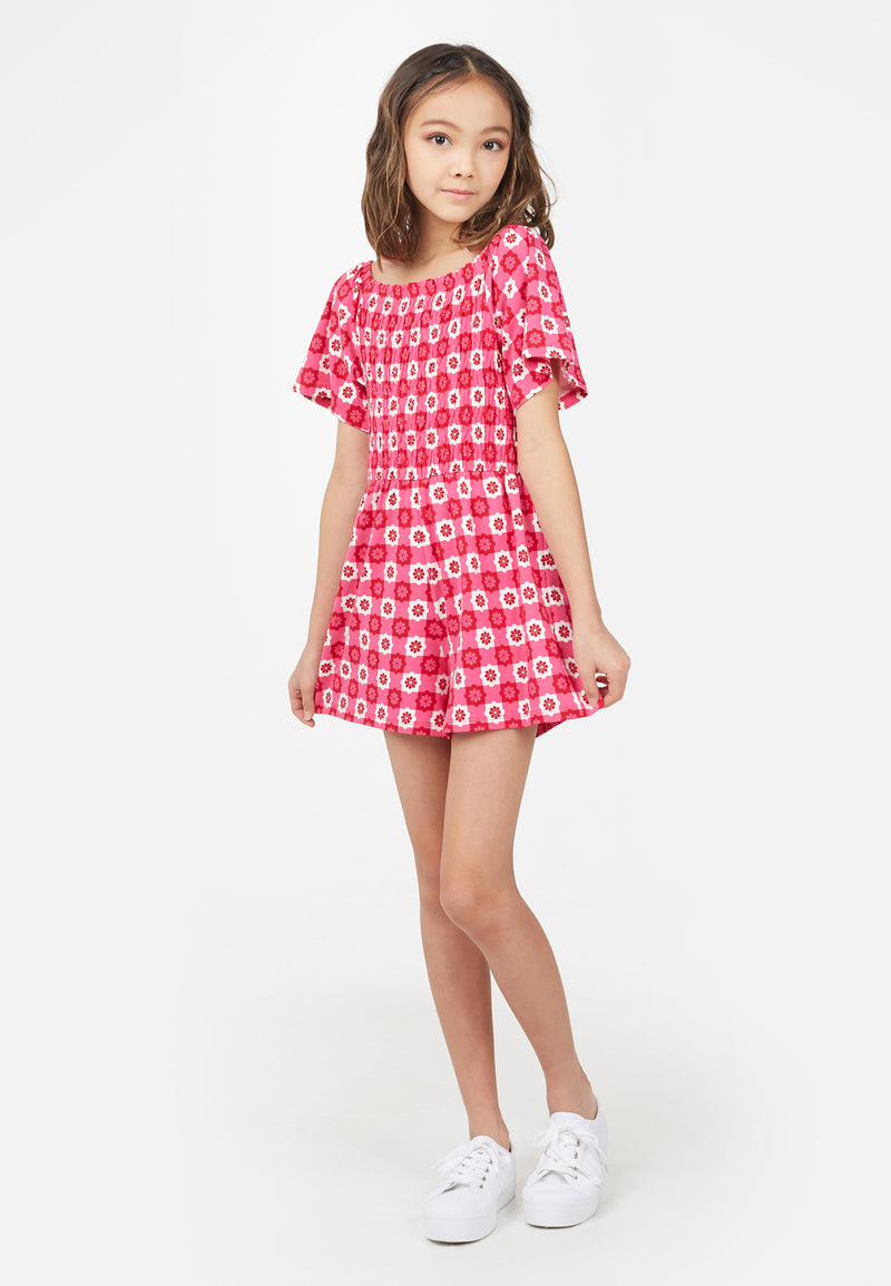 Teenage girl wears the Retro Floral Print Pink Checkerboard Girls Playsuit by Gen Woo