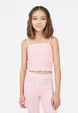 Teenage girl wears the Gingham Shirred Strappy Girls Crop Top by Gen Woo