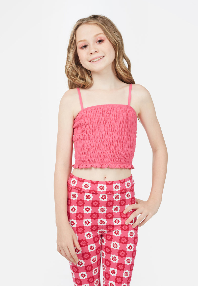 Teenage girl wears the Pink Shirred Strappy Girls Crop Top by Gen Woo