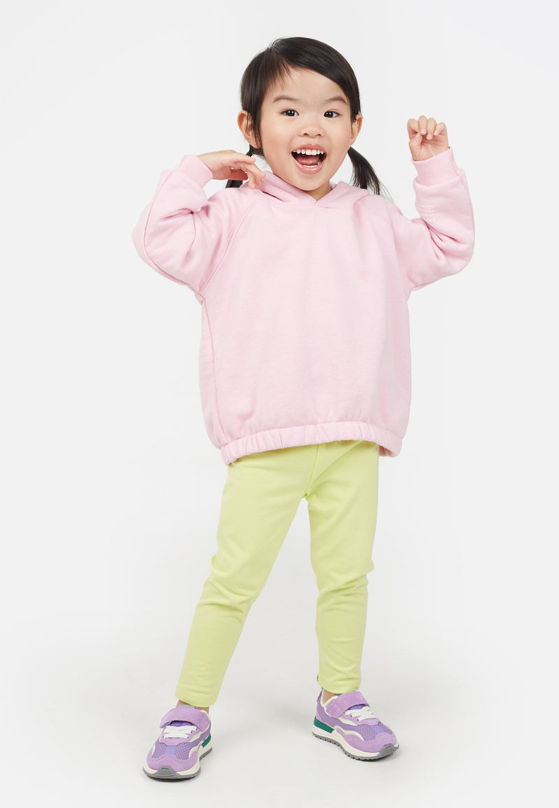 Little girl wears the Cotton Rich Lime Baby Leggings by Gen Woo