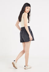 Back view of model wearing Ladies Washed Ecru Bodysuit by Gen Woo.