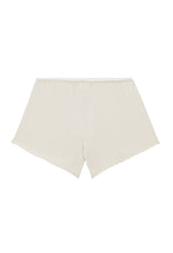 Ladies Shorts by Gen Woo. Our loose knit lounge shorts is high rise with elasticated waist. The white washed out shorts is suitable for home loungewear or nightwear. Please note that each washed out garment will have colour shade variation. –back view